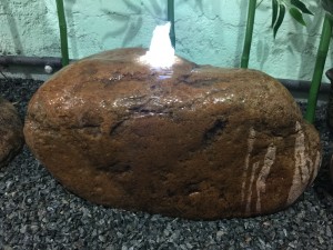 Natural boulder fountain with pebbles for sale